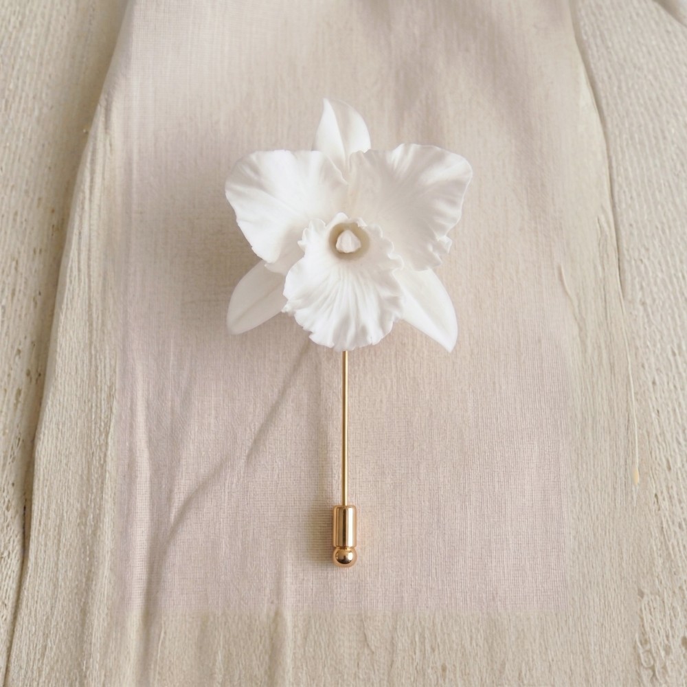 Ivory White cold porcelain cattleya orchid lapel pin on a gold stick pin